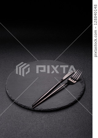 Empty plate with utensils as a conceptual background for lunch, breakfast, meal Empty plate with utensils as a conceptual background for lunch, breakfast, meal 128840148