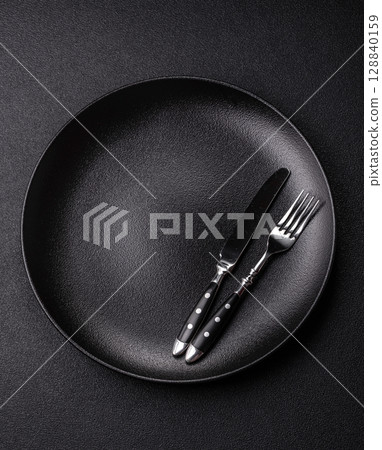 Empty plate with utensils as a conceptual background for lunch, breakfast, meal 128840159