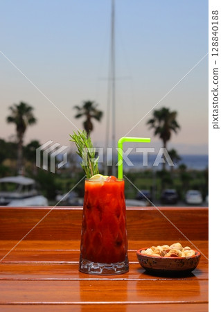 Margarita cocktail with lime, tequila, mint and ice on dark table with amazing backlight, copy space. Classic Margarita 128840188