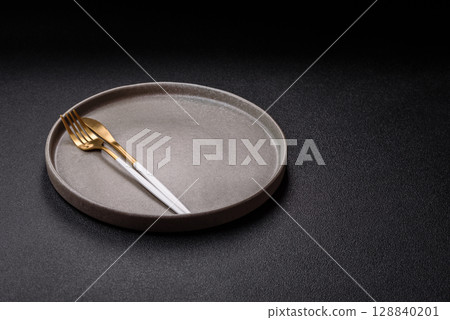 Empty plate with utensils as a conceptual background for lunch, breakfast, meal 128840201