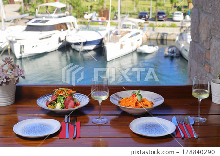 Seasonal Salad with Homemade Pastrami or bacon. With blush or rose wine. 128840290