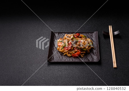 Chinese or Thai food, rice noodles with meat, salt and spices. Asian food 128840532