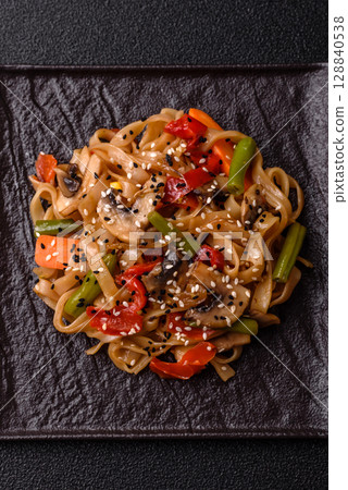 Chinese or Thai food, rice noodles with meat, salt and spices. Asian food Chinese or Thai food, rice noodles with meat, salt and spices. Asian food 128840538