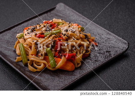 Chinese or Thai food, rice noodles with meat, salt and spices. Asian food 128840540