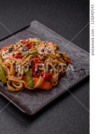 Chinese or Thai food, rice noodles with meat, salt and spices. Asian food Chinese or Thai food, rice noodles with meat, salt and spices. Asian food 128840543