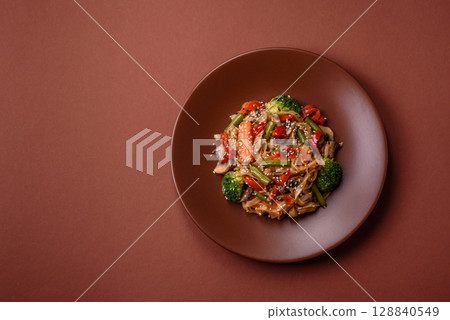 Chinese or Thai food, rice noodles with meat, salt and spices. Asian food 128840549