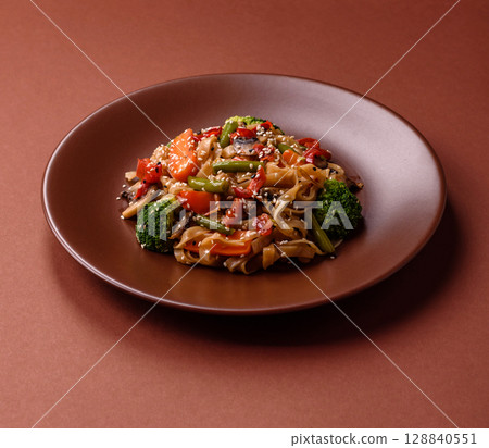 Chinese or Thai food, rice noodles with meat, salt and spices. Asian food Chinese or Thai food, rice noodles with meat, salt and spices. Asian food 128840551