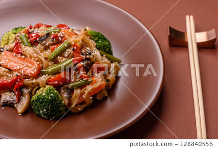 Chinese or Thai food, rice noodles with meat, salt and spices. Asian food 128840556