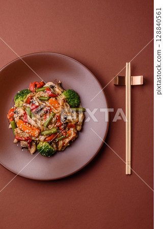 Chinese or Thai food, rice noodles with meat, salt and spices. Asian food 128840561