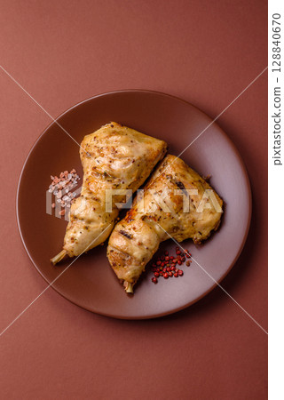 Grilled chicken leg or quarter. Barbecued meat with salt and spices 128840670