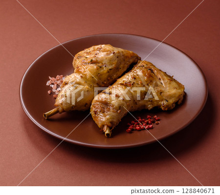 Grilled chicken leg or quarter. Barbecued meat with salt and spices 128840671
