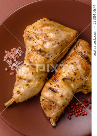 Grilled chicken leg or quarter. Barbecued meat with salt and spices Grilled chicken leg or quarter. Barbecued meat with salt and spices 128840674