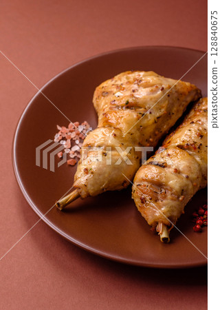 Grilled chicken leg or quarter. Barbecued meat with salt and spices Grilled chicken leg or quarter. Barbecued meat with salt and spices 128840675