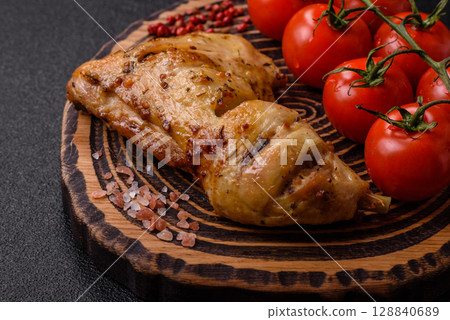 Grilled chicken leg or quarter. Barbecued meat with salt and spices 128840689