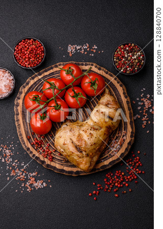 Grilled chicken leg or quarter. Barbecued meat with salt and spices Grilled chicken leg or quarter. Barbecued meat with salt and spices 128840700