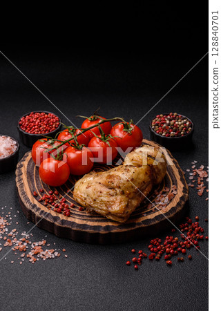 Grilled chicken leg or quarter. Barbecued meat with salt and spices 128840701