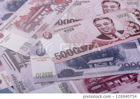 North korea money, won, paper banknotes. Conceptual background 128840754