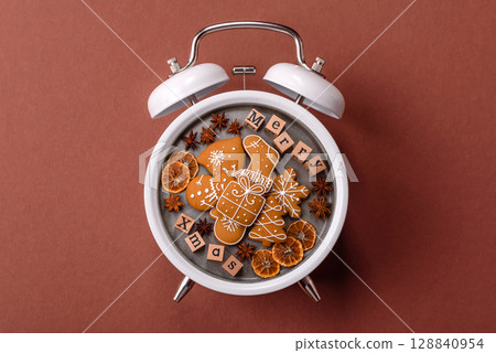 Christmas, gingerbread or biscuits on a plate on a clock. Christmas time conceptual background Christmas, gingerbread or biscuits on a plate on a clock. Christmas time conceptual background 128840954