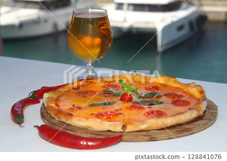 assorted pizza with different fillings: salami, tomatoes, mushrooms, bacon, sun-dried tomatoes assorted pizza with different fillings: salami, tomatoes, mushrooms, bacon, sun-dried tomatoes 128841076