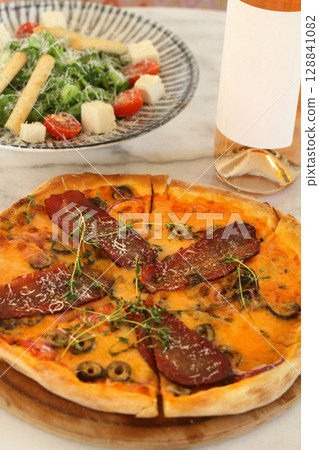 assorted pizza with different fillings: salami, tomatoes, mushrooms, bacon, sun-dried tomatoes assorted pizza with different fillings: salami, tomatoes, mushrooms, bacon, sun-dried tomatoes 128841082