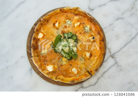 Brazilian pizza with sun-dried tomatoes, arugula and mozzarella. Traditional Brazilian Pizza Brazilian pizza with sun-dried tomatoes, arugula and mozzarella. Traditional Brazilian Pizza 128841086