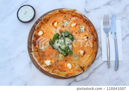 Brazilian pizza with sun-dried tomatoes, arugula and mozzarella. Traditional Brazilian Pizza Brazilian pizza with sun-dried tomatoes, arugula and mozzarella. Traditional Brazilian Pizza 128841087