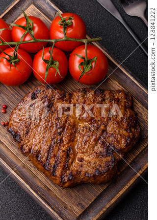 Meat, steak, beef tenderloin cooked on grill. Juicy steak as a food background Meat, steak, beef tenderloin cooked on grill. Juicy steak as a food background 128841222