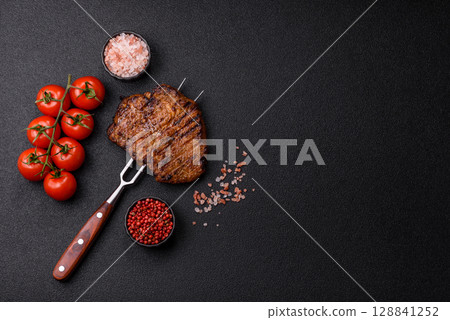 Meat, steak, beef tenderloin cooked on grill. Juicy steak as a food background Meat, steak, beef tenderloin cooked on grill. Juicy steak as a food background 128841252