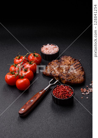 Meat, steak, beef tenderloin cooked on grill. Juicy steak as a food background Meat, steak, beef tenderloin cooked on grill. Juicy steak as a food background 128841254
