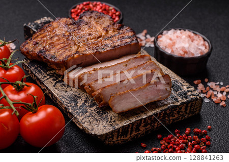 Meat, steak, beef tenderloin cooked on grill. Juicy steak as a food background Meat, steak, beef tenderloin cooked on grill. Juicy steak as a food background 128841263