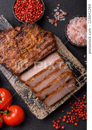 Meat, steak, beef tenderloin cooked on grill. Juicy steak as a food background 128841264