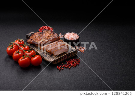 Meat, steak, beef tenderloin cooked on grill. Juicy steak as a food background Meat, steak, beef tenderloin cooked on grill. Juicy steak as a food background 128841265