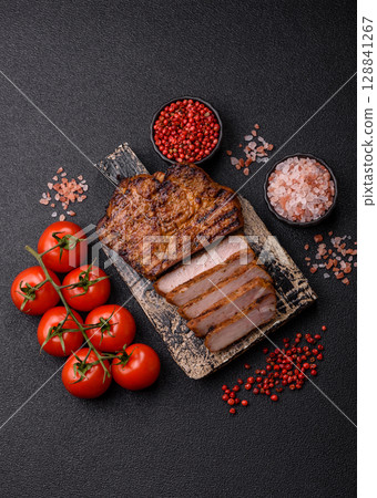 Meat, steak, beef tenderloin cooked on grill. Juicy steak as a food background Meat, steak, beef tenderloin cooked on grill. Juicy steak as a food background 128841267