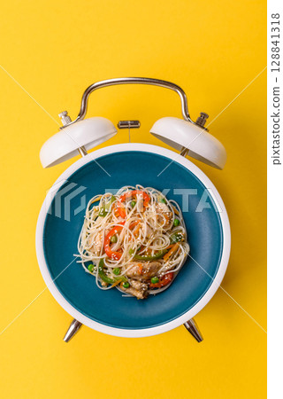 Italian pasta with meat, sauce and vegetables. Conceptual background time to eat pasta Italian pasta with meat, sauce and vegetables. Conceptual background time to eat pasta 128841318
