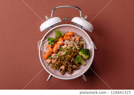 Vegetarian salad with quinoa, vegetables and meat. Conceptual background time to eat vegetarian food 128841325
