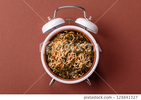 Italian pasta with meat, sauce and vegetables. Conceptual background time to eat pasta 128841327