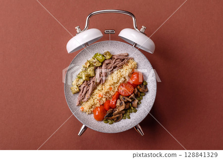 Vegetarian salad with quinoa, vegetables and meat. Conceptual background time to eat vegetarian food 128841329