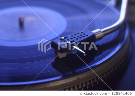 old vinyl record with clipping path. Close up at the needle on turntable 128841406