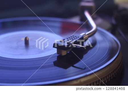 old vinyl record with clipping path. Close up at the needle on turntable 128841408