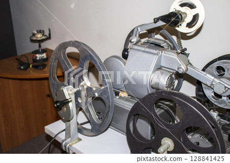 Shot of the vintage, old, obsolete movie film projector 128841425