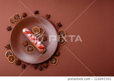 French food, dessert eclair with chocolate filling. Eclair as a background French food, dessert eclair with chocolate filling. Eclair as a background 128841501