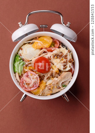 Italian pasta with meat, sauce and vegetables. Conceptual background time to eat pasta Italian pasta with meat, sauce and vegetables. Conceptual background time to eat pasta 128841553