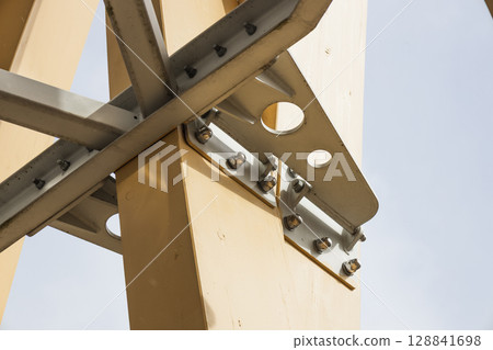 Engineered Timber Column with Steel Plate Connection and Bolts in Modern Hybrid Construction 128841698