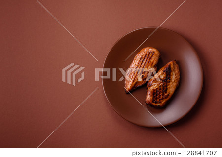 Chicken breast, grilled fillet, meat meal on a plate. Grilled poultry for dinner 128841707