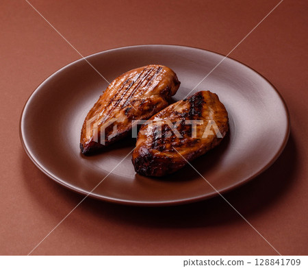 Chicken breast, grilled fillet, meat meal on a plate. Grilled poultry for dinner 128841709