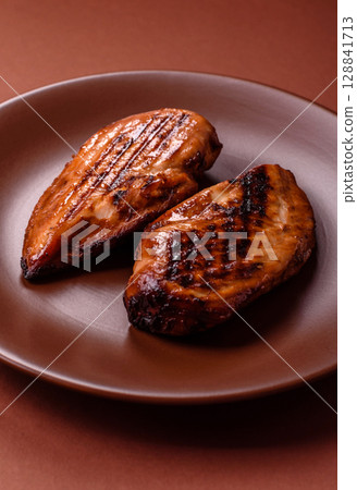 Chicken breast, grilled fillet, meat meal on a plate. Grilled poultry for dinner 128841713