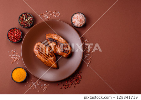 Chicken breast, grilled fillet, meat meal on a plate. Grilled poultry for dinner 128841719