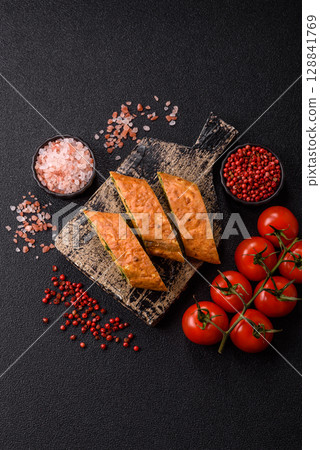 Roll of omelette, spinach, cheese and minced meat Roll of omelette, spinach, cheese and minced meat 128841769
