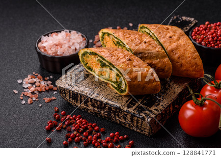 Roll of omelette, spinach, cheese and minced meat Roll of omelette, spinach, cheese and minced meat 128841771