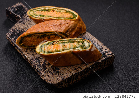 Roll of omelette, spinach, cheese and minced meat Roll of omelette, spinach, cheese and minced meat 128841775
